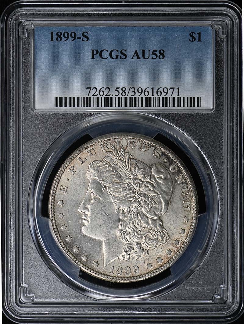 PCGS AU58 1899 San Francisco Morgan Silver Dollar: PCGS AU58 1899 San Francisco Morgan Silver Dollar This is an 1899-S Morgan Dollar graded AU58 by PCGS. Minted in San Francisco, this circulated coin is a classic example of the Morgan Dollar from the