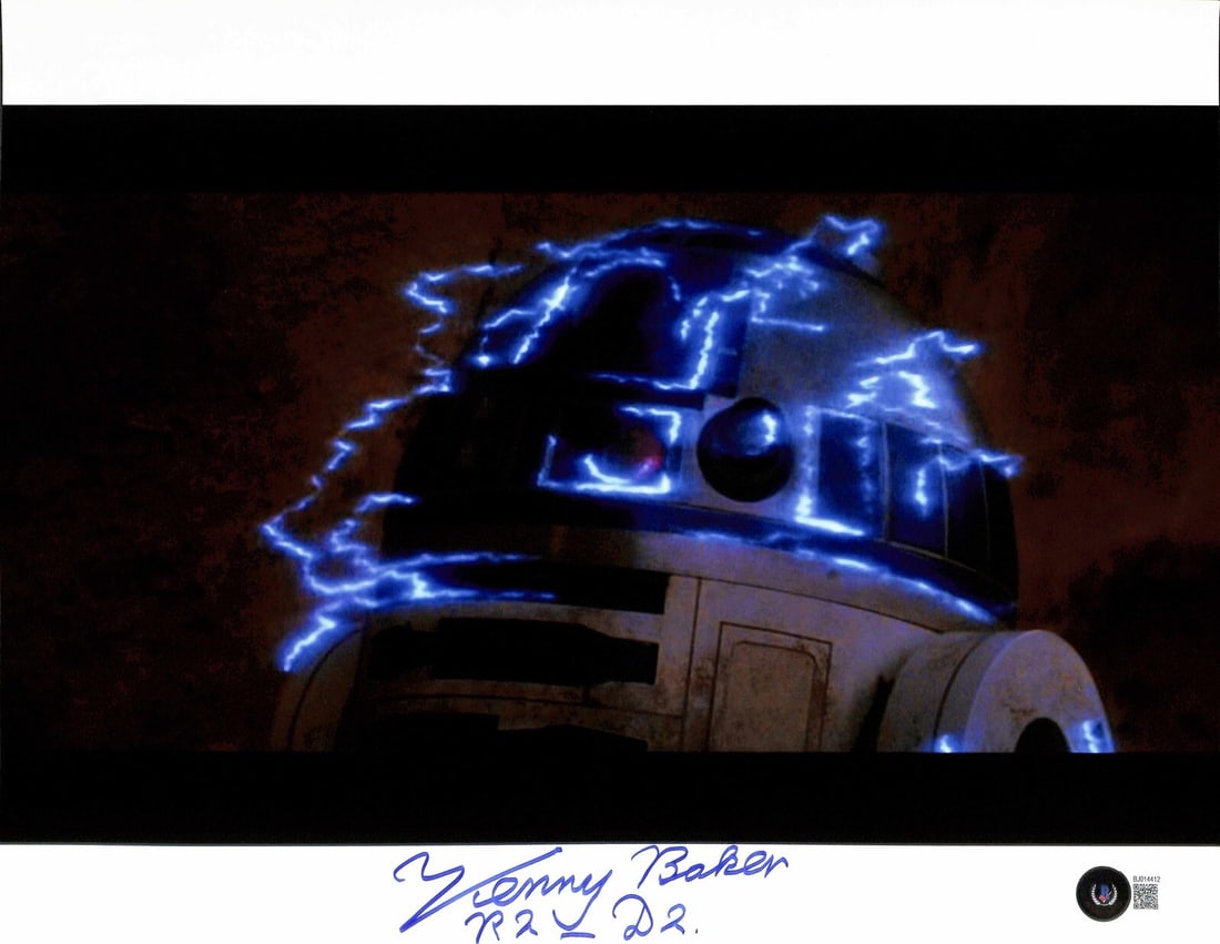 11x14 Signed Photo Kenny Baker as R2-D2 Beckett Authenticated Star Wars ROTJ: 11x14 Signed Photo Kenny Baker as R2-D2 Beckett Authenticated Star Wars ROTJ This is an original 11x14 photograph signed in blue permanent marker by Kenny Baker, who portrayed R2-D2 in Star Wars. The