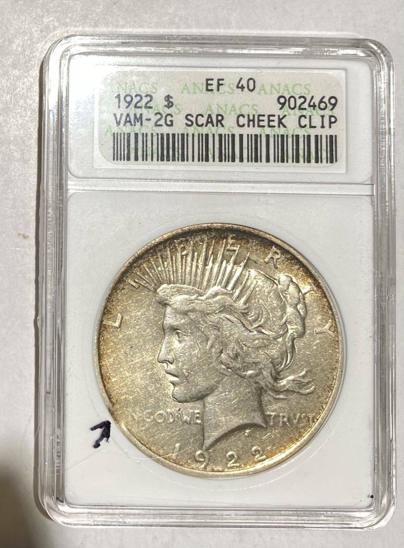 1922 P Peace Silver Dollar ANACS XF 40 VAM 2G Scar Cheek Clip: 1922 P Peace Silver Dollar ANACS XF 40 VAM 2G Scar Cheek Clip This 1922 P Peace Silver Dollar is a remarkable piece of numismatic history, certified by ANACS with a grade of XF 40. Struck in Philadelp