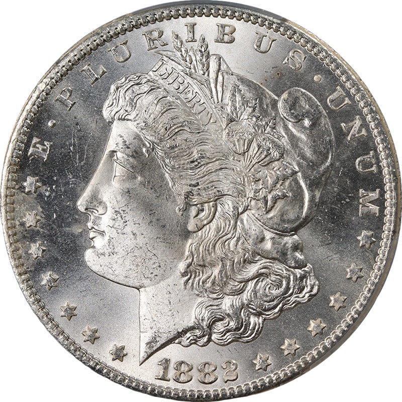 PCGS MS65 1882-CC Morgan Dollar Silver Coin with Brilliant Luster: PCGS MS65 1882-CC Morgan Dollar Silver Coin with Brilliant Luster This 1882-CC Morgan Silver Dollar is graded PCGS MS65, indicating it is uncirculated and in superb condition. The coin features a stro