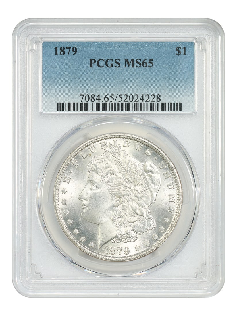 PCGS Graded MS65 1879 Morgan Silver Dollar Coin: PCGS Graded MS65 1879 Morgan Silver Dollar Coin This is an 1879 Morgan Dollar graded MS65 by PCGS. The coin is uncirculated and was minted in Philadelphia. It is part of the Morgan Dollar series and h