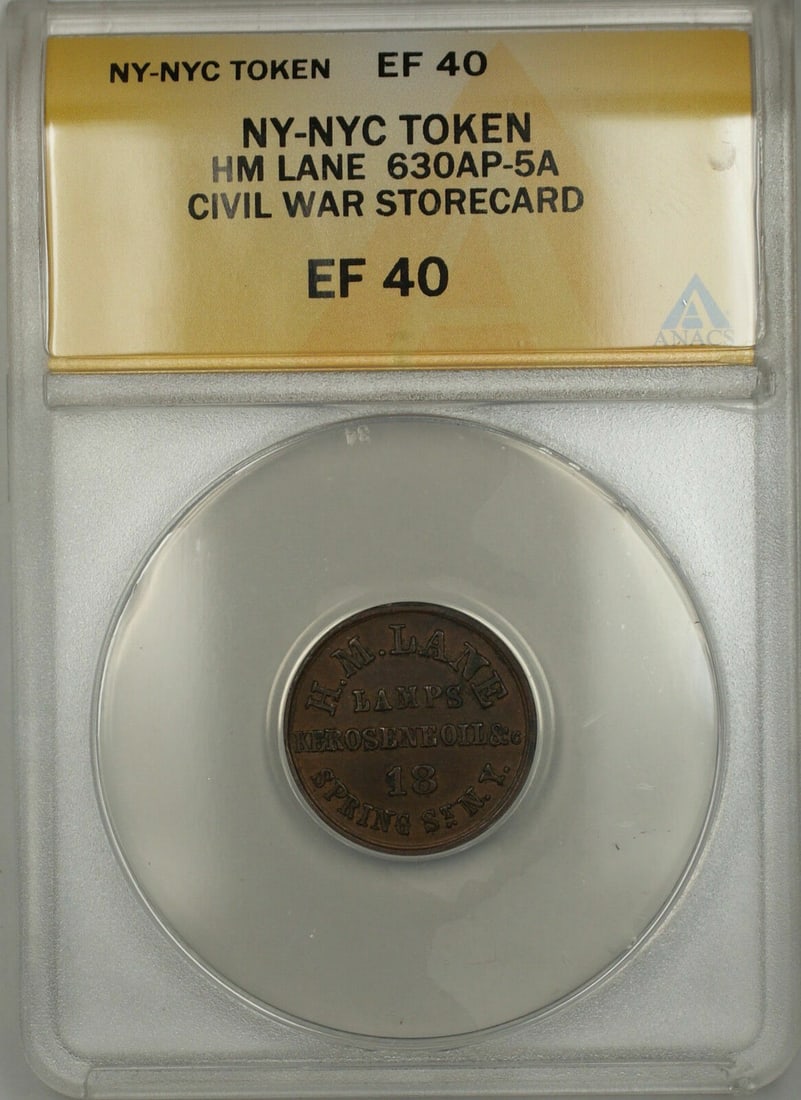 ANACS EF-40 630AP-5A HM Lane Storecard Token New York Civil War: ANACS EF-40 630AP-5A HM Lane Storecard Token New York Civil War This is a Civil War era NY-NYC HM Lane storecard token, cataloged as 630AP-5A. The token is certified by ANACS with a grade of EF 40, in