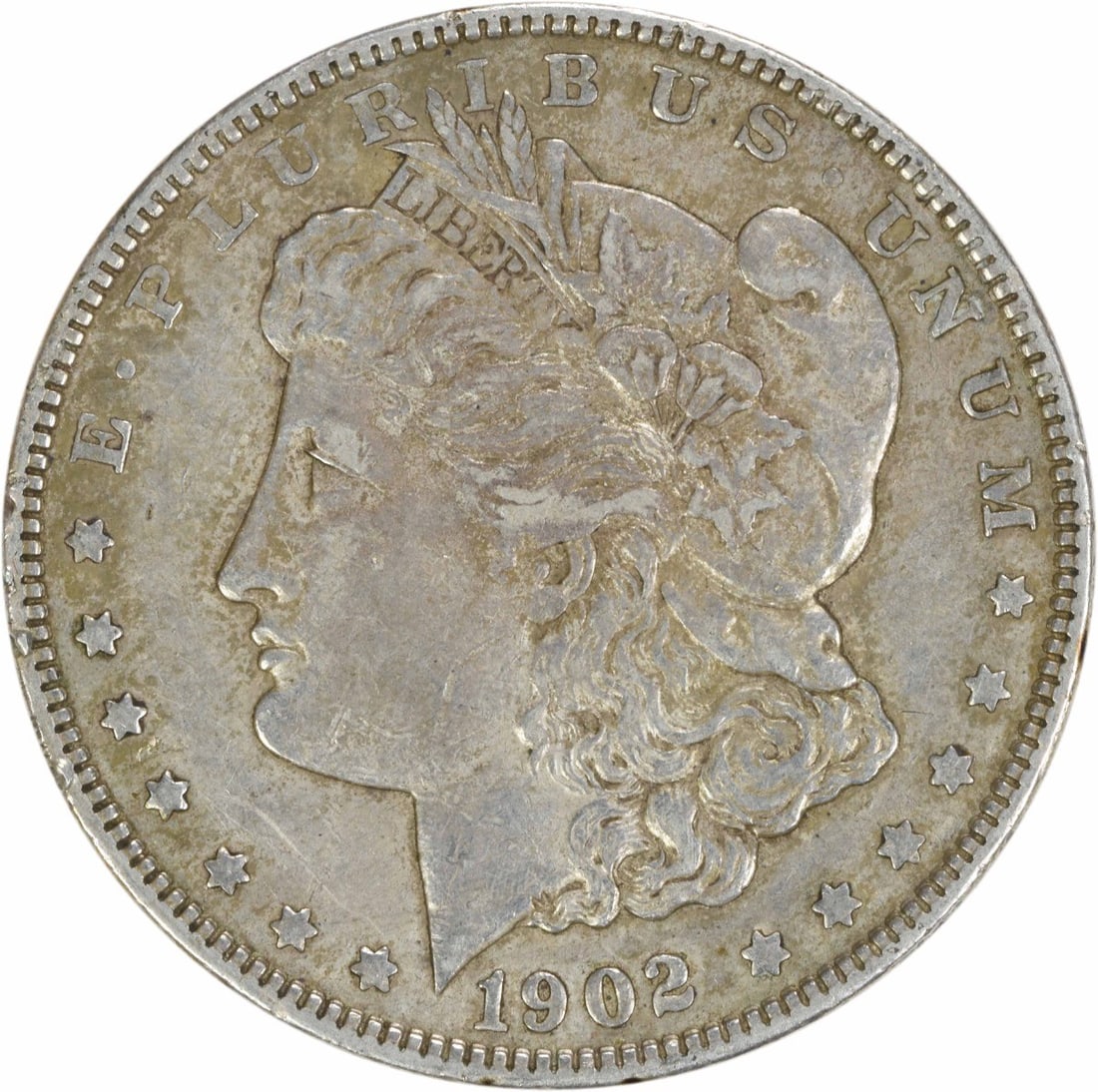 1902 Morgan Silver Dollar EF Uncertified 90% Silver Coin: 1902 Morgan Silver Dollar EF Uncertified 90% Silver Coin This 1902 Morgan Silver Dollar is a remarkable piece for collectors, showcasing the historic craftsmanship of George T. Morgan. The coin is cir