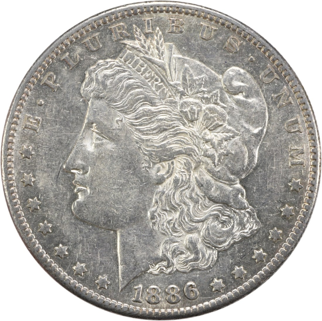 San Francisco Mint 1886 Morgan Dollar AU 90 Percent Silver Uncertified: San Francisco Mint 1886 Morgan Dollar AU 90 Percent Silver Uncertified This 1886-S Morgan Silver Dollar is an uncertified, pre-owned coin from the San Francisco Mint. Composed of 90% silver and 10% co