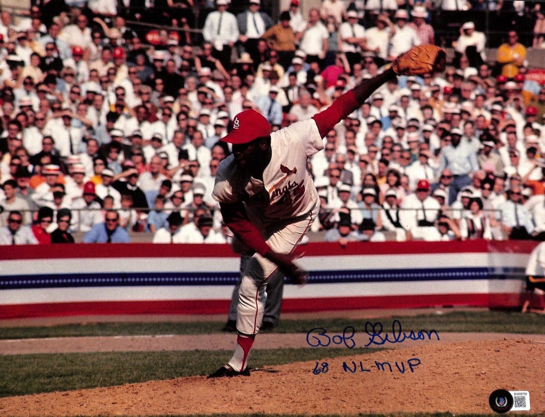 11x14 Photo Signed and Inscribed by Bob Gibson with Beckett Authentication: 11x14 Photo Signed and Inscribed by Bob Gibson with Beckett Authentication This is an original 11x14 photograph signed and inscribed by Bob Gibson. The autograph, written in blue permanent marker, inc