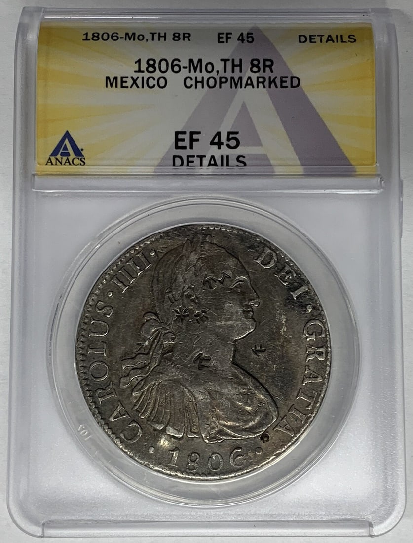 Chopmarked 1806 Mexico 8 Reales Silver Coin ANACS XF 45 Certified: Chopmarked 1806 Mexico 8 Reales Silver Coin ANACS XF 45 Certified This is an 1806-Mo TH 8 Reales silver coin from Mexico, issued during the Colonial period prior to 1821. The coin features a chopmark