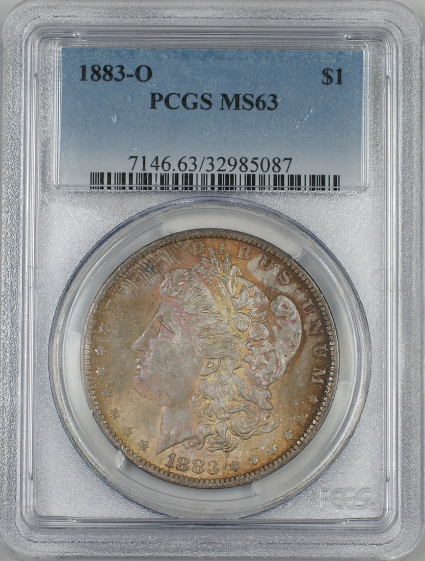 PCGS MS63 1883-O Morgan Dollar Silver Coin With Attractive Toning: PCGS MS63 1883-O Morgan Dollar Silver Coin With Attractive Toning This is an 1883-O Morgan Silver Dollar $1 coin, graded MS-63 by PCGS. The coin is uncirculated and features attractive toning on both