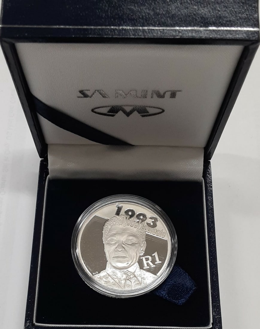 Nelson Mandela 2007 South Africa Silver 1 Rand Proof with Original Packaging: Nelson Mandela 2007 South Africa Silver 1 Rand Proof with Original Packaging This 2007 South Africa Mint Protea Commemorative 1 Rand Proof Coin honors Nelson Mandela and features his likeness on the r