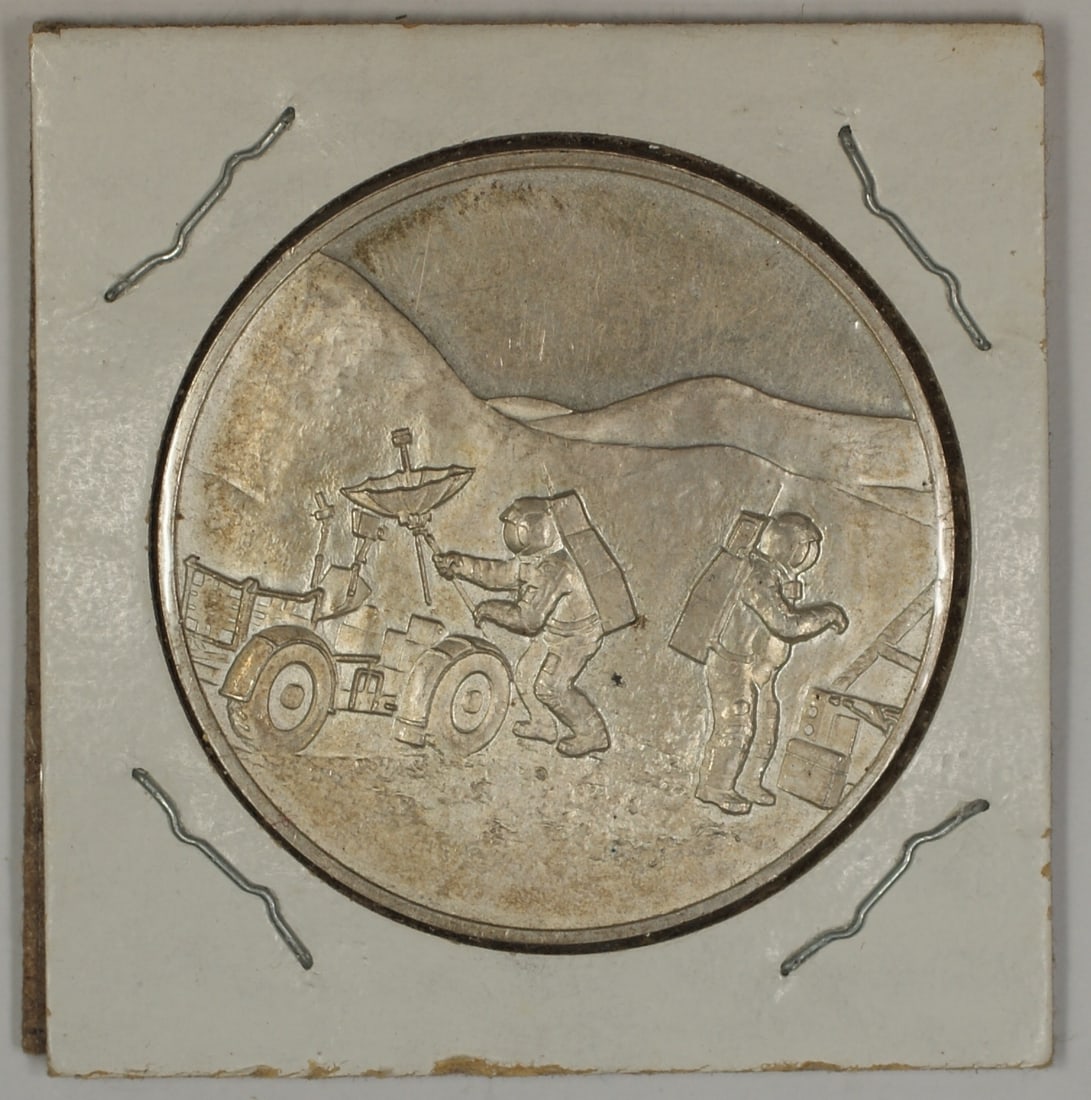 Silver Apollo 15 Medal with Scott Worden Irwin in 2x2 Cardboard Holder: Silver Apollo 15 Medal with Scott Worden Irwin in 2x2 Cardboard Holder This Apollo 15 (XV) silver medal features the names Scott, Worden, and Irwin and is presented in a 2x2 cardboard flip. The item i