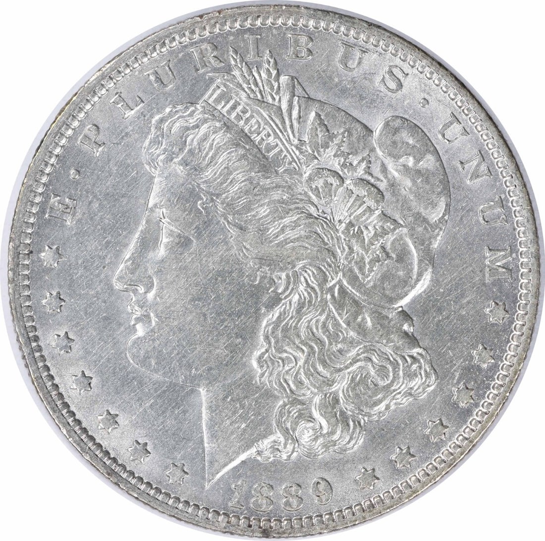 1889-O Morgan Silver Dollar AU Uncertified New Orleans Mint: 1889-O Morgan Silver Dollar AU Uncertified New Orleans Mint This 1889-O Morgan Silver Dollar is a beautiful example of American coinage, featuring a design by George T. Morgan. The coin is circulated