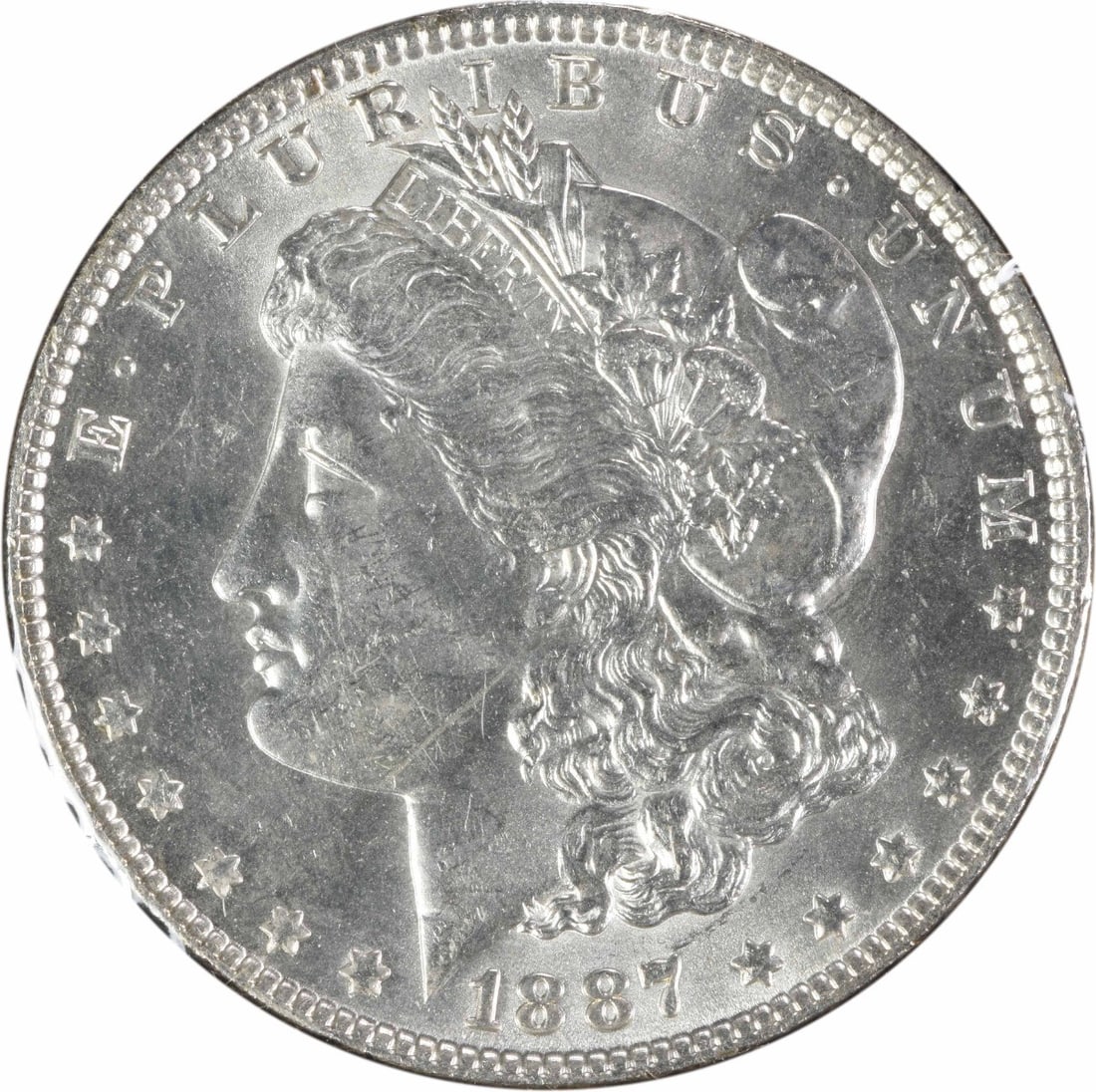 1887 VAM 12 Morgan Silver Dollar Alligator Eye Uncertified BU: 1887 VAM 12 Morgan Silver Dollar Alligator Eye Uncertified BU This 1887 Morgan Silver Dollar showcases a stunning alligator eye effect, with a grade of Brilliant Uncirculated (BU). The coin features a