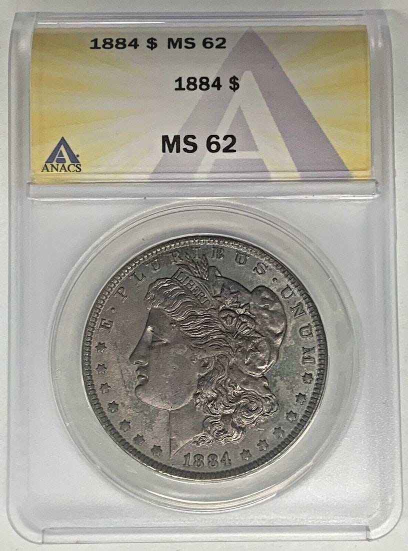 Toned 1884 Silver Dollar MS 62 ANACS Certified Morgan Coin: Toned 1884 Silver Dollar MS 62 ANACS Certified Morgan Coin This 1884 Morgan Silver Dollar features attractive toning and has been graded MS 62 by ANACS. The coin is composed of silver and remains unci