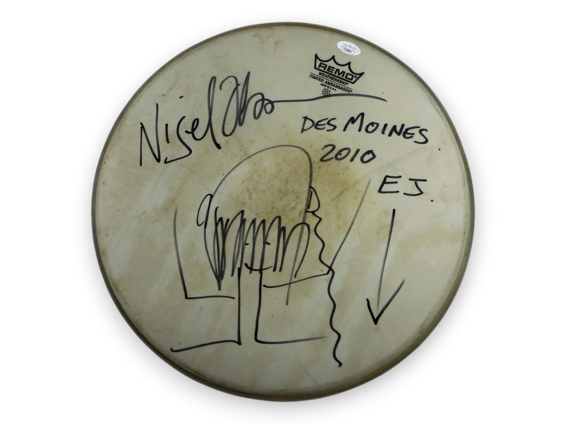 Nigel Olsson Signed 14 Drumhead with Sketch JSA Authentication: Nigel Olsson Signed 14 Drumhead with Sketch JSA Authentication This is an original 14" concert-used drumhead signed by the legendary musician Nigel Olsson. The drumhead features a unique sketch and is