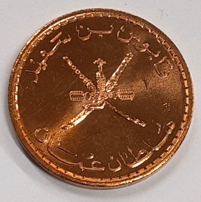 Roll of 20 Uncirculated 1990 Oman 5 Baisa Bronze Coins KM 50: Roll of 20 Uncirculated 1990 Oman 5 Baisa Bronze Coins KM 50 This is a roll of twenty 1990 Oman 5 Baisa coins, featuring Qaboos bin Said. Each coin is uncirculated and made of bronze with a reddish-br