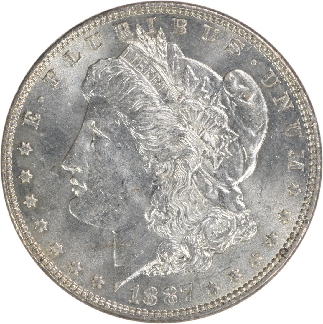 1887 Morgan Silver Dollar Choice BU Uncertified Silver Coin: 1887 Morgan Silver Dollar Choice BU Uncertified Silver Coin This 1887 Morgan Silver Dollar is a stunning example of American coinage, showcasing the iconic design that has captivated collectors for ge