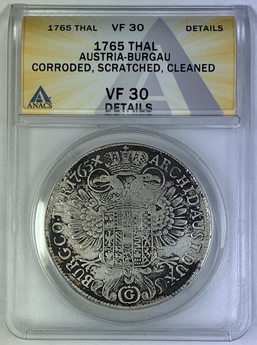 Silver Austria-Burgau 1765 Thal Coin Certified by ANACS VF 30: Silver Austria-Burgau 1765 Thal Coin Certified by ANACS VF 30 This 1765 Austria-Burgau Thal coin is composed of silver and has been graded VF 30 by ANACS. It originates from Austria and is certified b