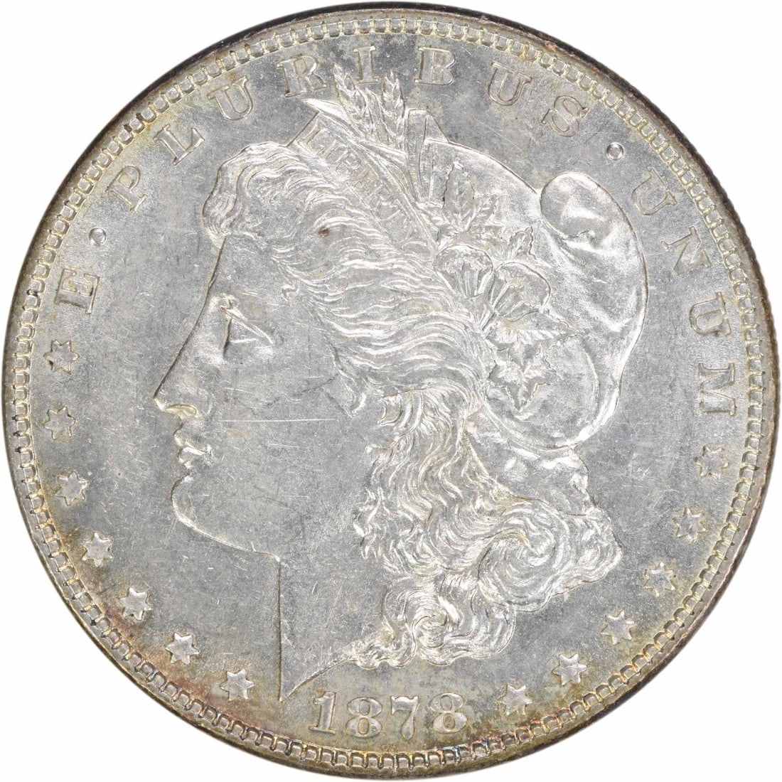 1878 Morgan Silver Dollar AU Uncertified 90% Silver Coin: 1878 Morgan Silver Dollar AU Uncertified 90% Silver Coin This 1878 Morgan Silver Dollar is a remarkable piece of American coinage, featuring a design by George T. Morgan. It has a wonderful AU (About