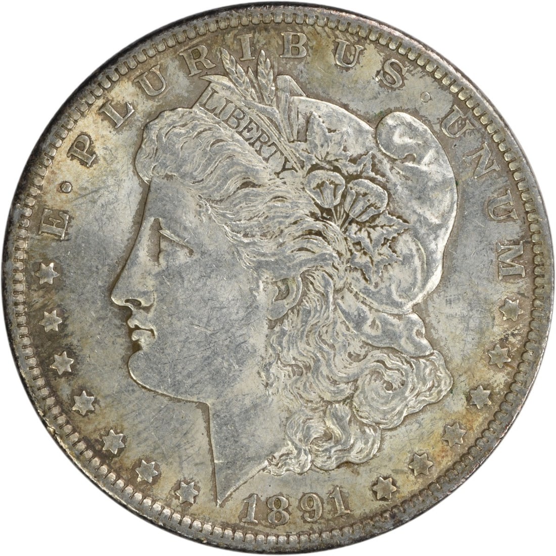 1891 Morgan Silver Dollar AU Uncertified 90% Silver Coin: 1891 Morgan Silver Dollar AU Uncertified 90% Silver Coin This 1891 Morgan Silver Dollar is a remarkable piece of numismatic history, featuring a design by George T. Morgan. The coin is composed of 90%