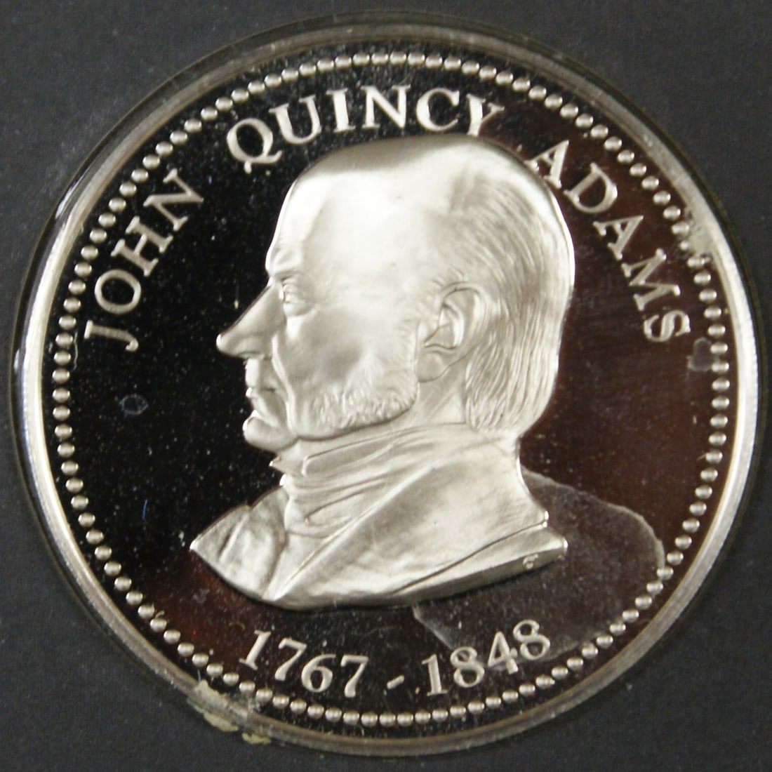 Proof Sterling Silver John Quincy Adams Medal with Original Franklin Mint Card: Proof Sterling Silver John Quincy Adams Medal with Original Franklin Mint Card This John Quincy Adams proof medal is crafted from sterling silver and comes in its original Franklin Mint card. The meda