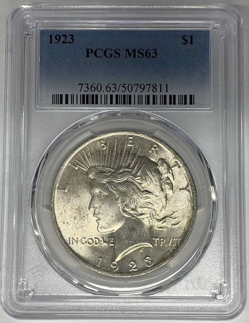 PCGS Certified MS 63 1923 Peace Dollar Silver Coin United States: PCGS Certified MS 63 1923 Peace Dollar Silver Coin United States This is a 1923 Peace Silver Dollar coin from the United States, certified by PCGS with a grade of MS 63. The coin is composed of silver