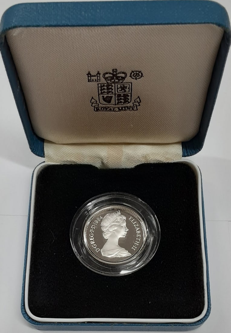 Proof Silver Piedfort 1 Pound Coin 1984 United Kingdom With Box and COA: Proof Silver Piedfort 1 Pound Coin 1984 United Kingdom With Box and COA This 1984 United Kingdom 1 Pound Silver Proof Piedfort coin features a 0.925 fine silver composition and is uncirculated. The co