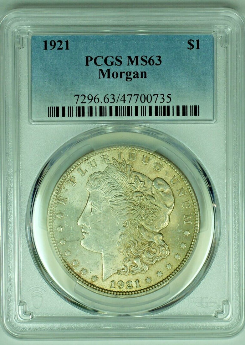 PCGS MS 63 1921 Morgan Silver Dollar Toned Uncirculated Coin: PCGS MS 63 1921 Morgan Silver Dollar Toned Uncirculated Coin This 1921 Morgan Silver Dollar features attractive toning and is graded MS 63 by PCGS. The coin is uncirculated and composed of silver, rep