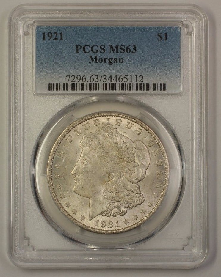 1921 Morgan Dollar Silver $1 Philadelphia PCGS MS-63 Certified Coin: 1921 Morgan Dollar Silver $1 Philadelphia PCGS MS-63 Certified Coin This 1921 US Morgan Silver Dollar is certified by PCGS with an MS-63 grade. Struck in Philadelphia, the coin is composed of silver a