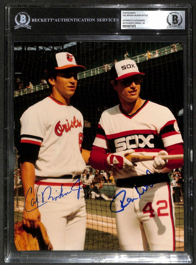 Cal Ripken Jr Ron Kittle Signed 1983 ASG 8x10 Photo BAS Auto Grade 10: Cal Ripken Jr Ron Kittle Signed 1983 ASG 8x10 Photo BAS Auto Grade 10 This stunning 8x10 photograph captures a rare moment from the 1983 MLB All-Star Game at Comiskey Park in Chicago, featuring dual a
