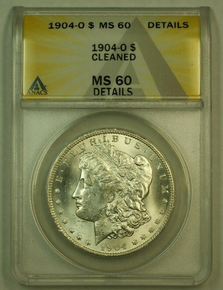 ANACS MS-60 Cleaned 1904-O Morgan Silver Dollar New Orleans Mint: ANACS MS-60 Cleaned 1904-O Morgan Silver Dollar New Orleans Mint This is a 1904-O Morgan Silver Dollar graded MS-60 Details by ANACS. The coin was minted in New Orleans and is composed of 0.9 fine sil