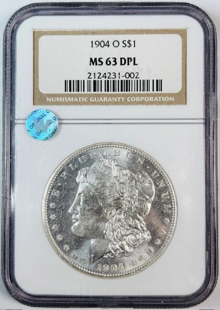 NGC MS63 DPL 1904 O Silver Morgan Dollar Uncirculated Deep Prooflike: NGC MS63 DPL 1904 O Silver Morgan Dollar Uncirculated Deep Prooflike This is a 1904 O Morgan Silver Dollar graded MS-63 Deep Proof Like (DPL) by NGC. The coin is uncirculated, features a sight white a