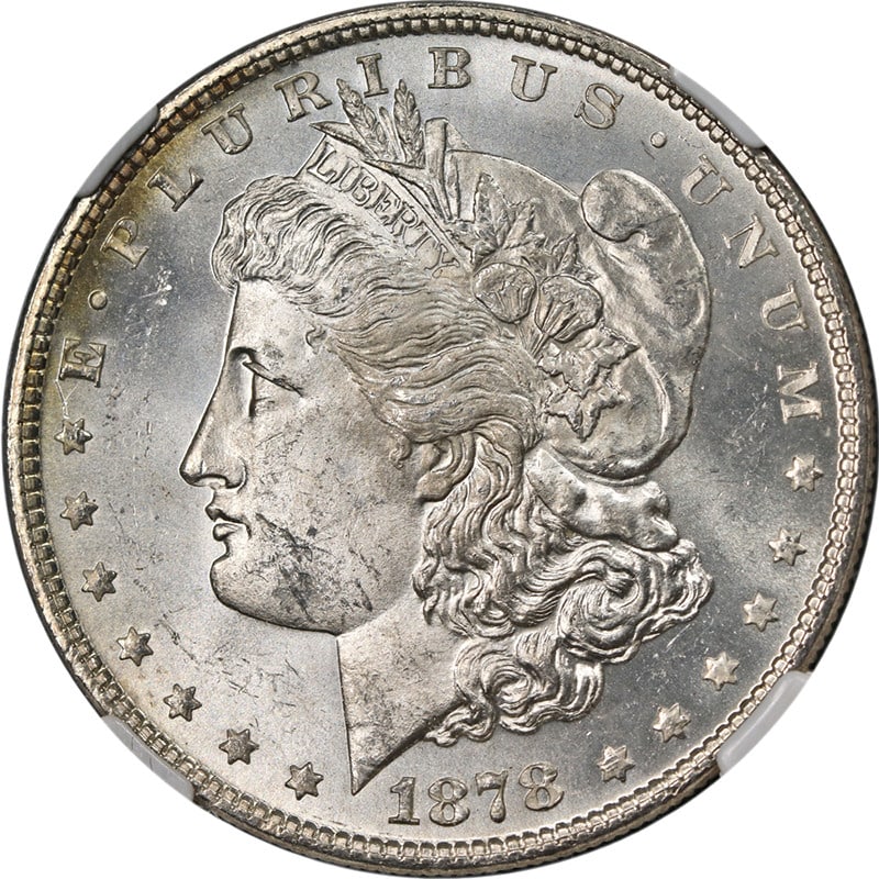 NGC MS64 1878 Philadelphia Morgan Silver Dollar 7 Tail Feathers Reverse 78: NGC MS64 1878 Philadelphia Morgan Silver Dollar 7 Tail Feathers Reverse 78 This 1878-P 7 Tail Feathers Reverse 78 Morgan Silver Dollar is certified by NGC with a grade of MS64. Struck at the Philadelp