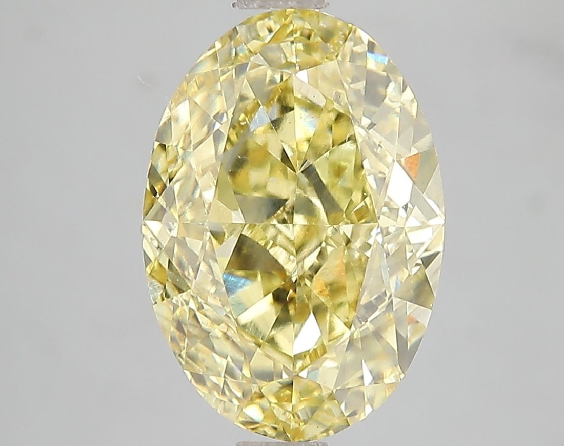 Loose Diamond - OVAL 5.03ct Fancy Vivid Yellow VS2: Loose Diamond - OVAL 5.03ct Fancy Vivid Yellow VS2 Source: This is a real non-mined Diamond that has been grown in a lab Shape: OVAL Carats: 5.03 Color: Fancy Vivid Yellow Certification: IGI Video: