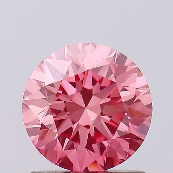 Loose Diamond - ROUND 1.04ct Fancy Vivid Pink VS1: Loose Diamond - ROUND 1.04ct Fancy Vivid Pink VS1 Source: This is a real non-mined Diamond that has been grown in a lab Shape: ROUND Carats: 1.04 Color: Fancy Vivid Pink Certification: IGI Video: