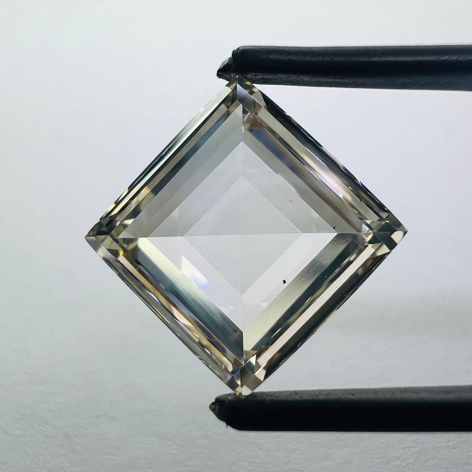 Loose Diamond - SQUARE 6.8ct Brown VS2: Loose Diamond - SQUARE 6.8ct Brown VS2 Source: This is a real non-mined Diamond that has been grown in a lab Shape: SQUARE Carats: 6.8 Color: Brown Certification: NONE Additional images available upon