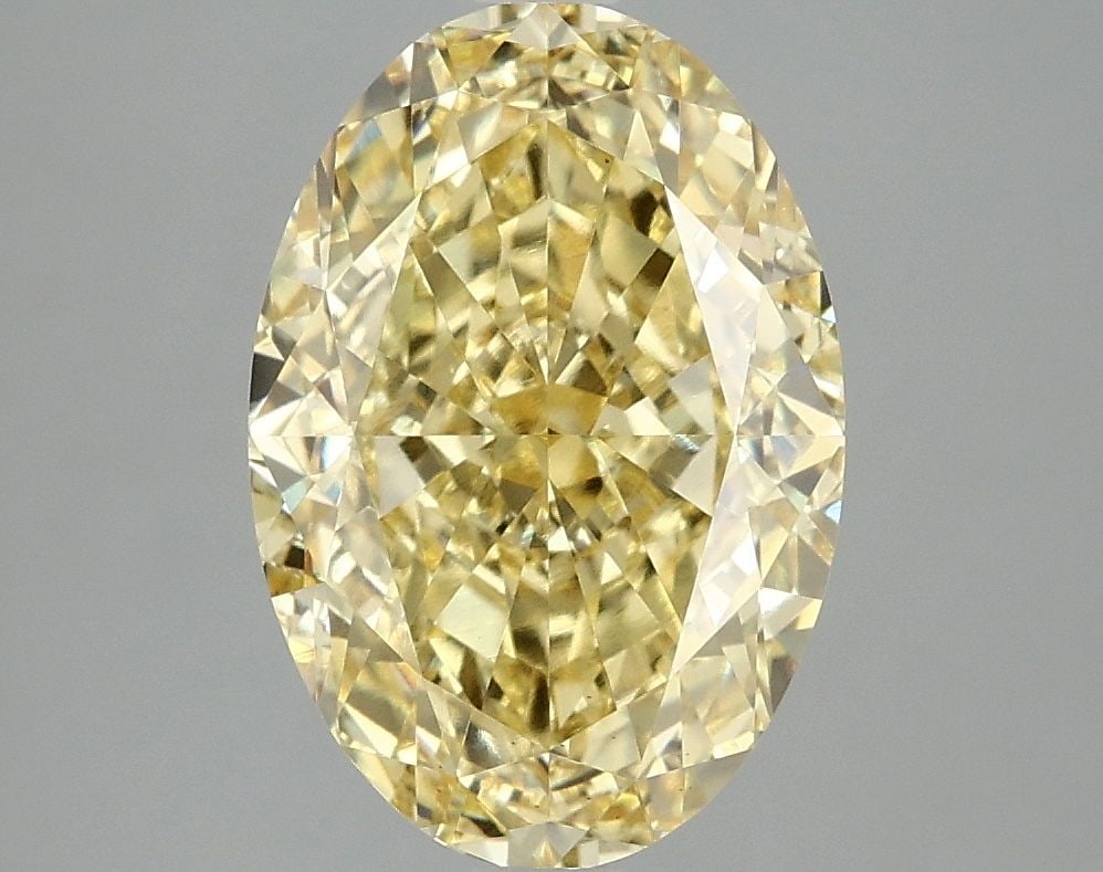 Loose Diamond - OVAL 4.09ct Fancy Vivid Yellow VS2: Loose Diamond - OVAL 4.09ct Fancy Vivid Yellow VS2 Source: This is a real non-mined Diamond that has been grown in a lab Shape: OVAL Carats: 4.09 Color: Fancy Vivid Yellow Certification: IGI Video: