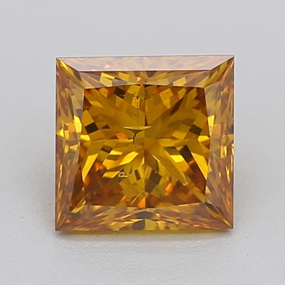 Loose Diamond - PRINCESS 0.51ct Fancy Vivid Orangey Yellow SI2: Loose Diamond - PRINCESS 0.51ct Fancy Vivid Orangey Yellow SI2 Source: This is a real non-mined Diamond that has been grown in a lab Shape: PRINCESS Carats: 0.51 Color: Fancy Vivid Orangey Yellow Cert