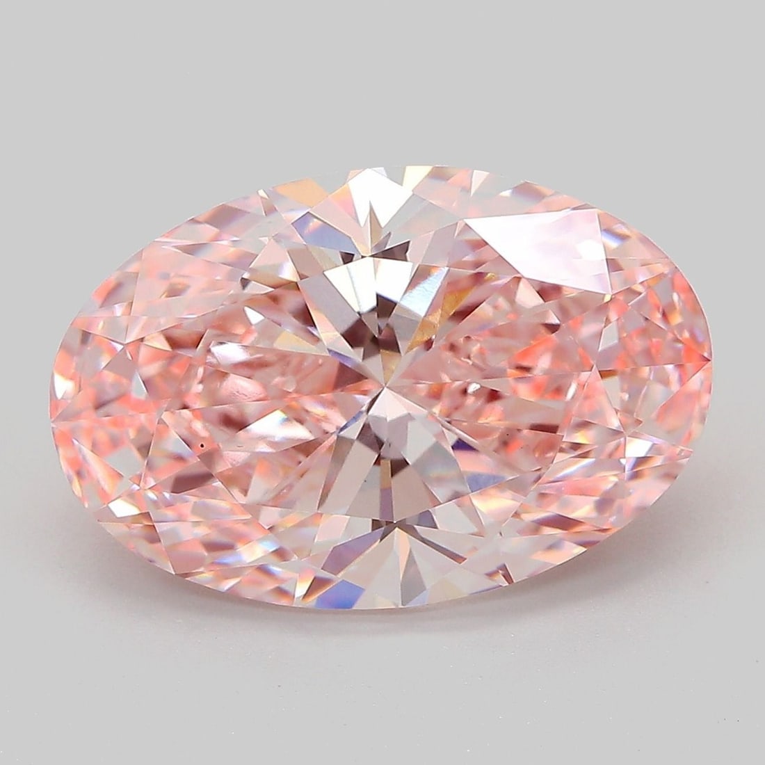 Loose Diamond - OVAL 7.06ct Fancy Vivid Pink VS1: Loose Diamond - OVAL 7.06ct Fancy Vivid Pink VS1 Source: This is a real non-mined Diamond that has been grown in a lab Shape: OVAL Carats: 7.06 Color: Fancy Vivid Pink Certification: IGI Video: