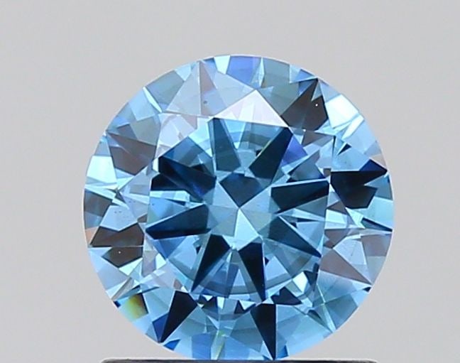 Loose Diamond - ROUND 1.01ct Fancy Vivid Blue SI2: Loose Diamond - ROUND 1.01ct Fancy Vivid Blue SI2 Source: This is a real non-mined Diamond that has been grown in a lab Shape: ROUND Carats: 1.01 Color: Fancy Vivid Blue Certification: IGI Video: