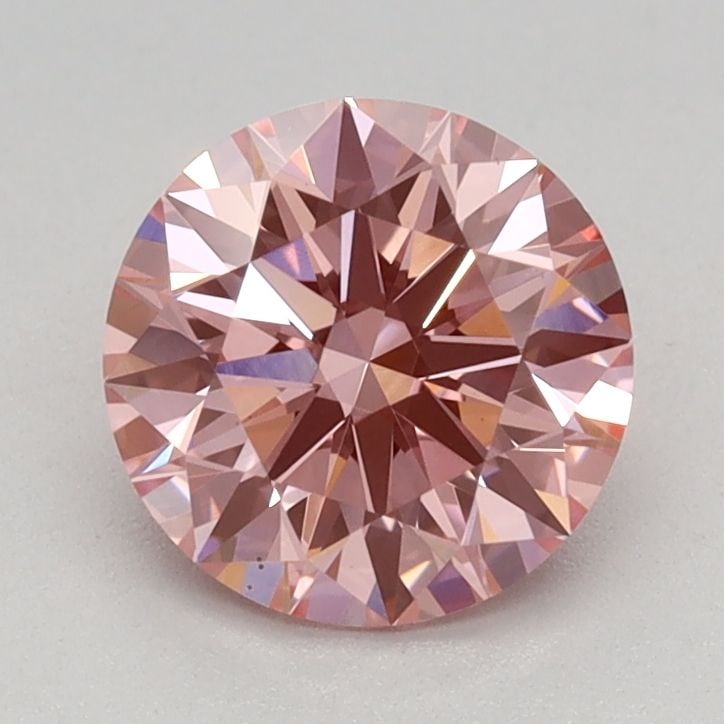 Ideal Loose Diamond - ROUND 0.92ct Fancy Vivid Pink VS1: Ideal Loose Diamond - ROUND 0.92ct Fancy Vivid Pink VS1 Source: This is a real non-mined Diamond that has been grown in a lab Shape: ROUND Carats: 0.92 Color: Fancy Vivid Pink Certification: IGI Video
