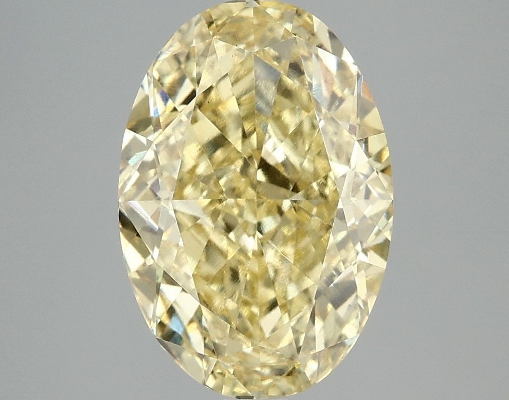 Loose Diamond - OVAL 4.07ct Fancy Vivid Yellow VS1: Loose Diamond - OVAL 4.07ct Fancy Vivid Yellow VS1 Source: This is a real non-mined Diamond that has been grown in a lab Shape: OVAL Carats: 4.07 Color: Fancy Vivid Yellow Certification: IGI Video: