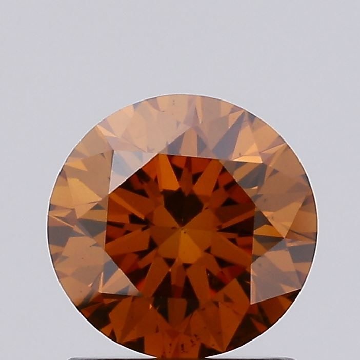 Ideal Loose Diamond - ROUND 1.06ct Fancy Vivid Orange VS2: Ideal Loose Diamond - ROUND 1.06ct Fancy Vivid Orange VS2 Source: This is a real non-mined Diamond that has been grown in a lab Shape: ROUND Carats: 1.06 Color: Fancy Vivid Orange Certification: IGI V