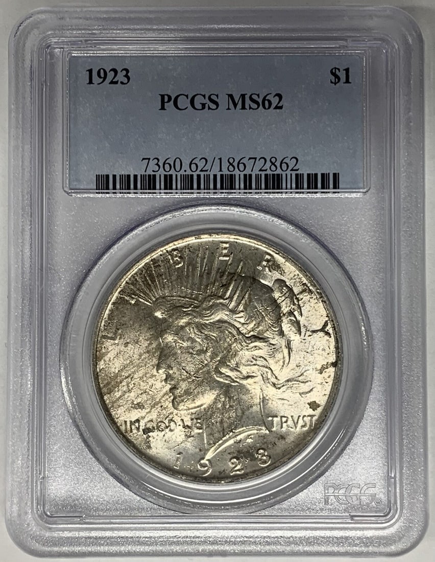 Peace Dollar 1923 Silver $1 Coin PCGS MS 62 Lightly Toned: Peace Dollar 1923 Silver $1 Coin PCGS MS 62 Lightly Toned This 1923 Peace Silver Dollar is a lightly toned coin graded MS 62 by PCGS. Struck in silver and uncirculated, it represents a classic example