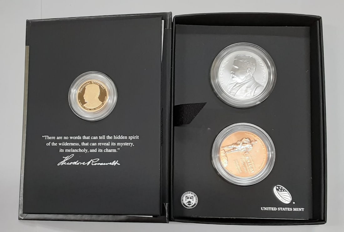 Theodore Roosevelt 2013 Coin and Chronicles Set With Box and Certificate: Theodore Roosevelt 2013 Coin and Chronicles Set With Box and Certificate This 2013 U.S. Mint Theodore Roosevelt Coin and Chronicles Set includes a Presidential Proof Dollar coin and two medals honorin