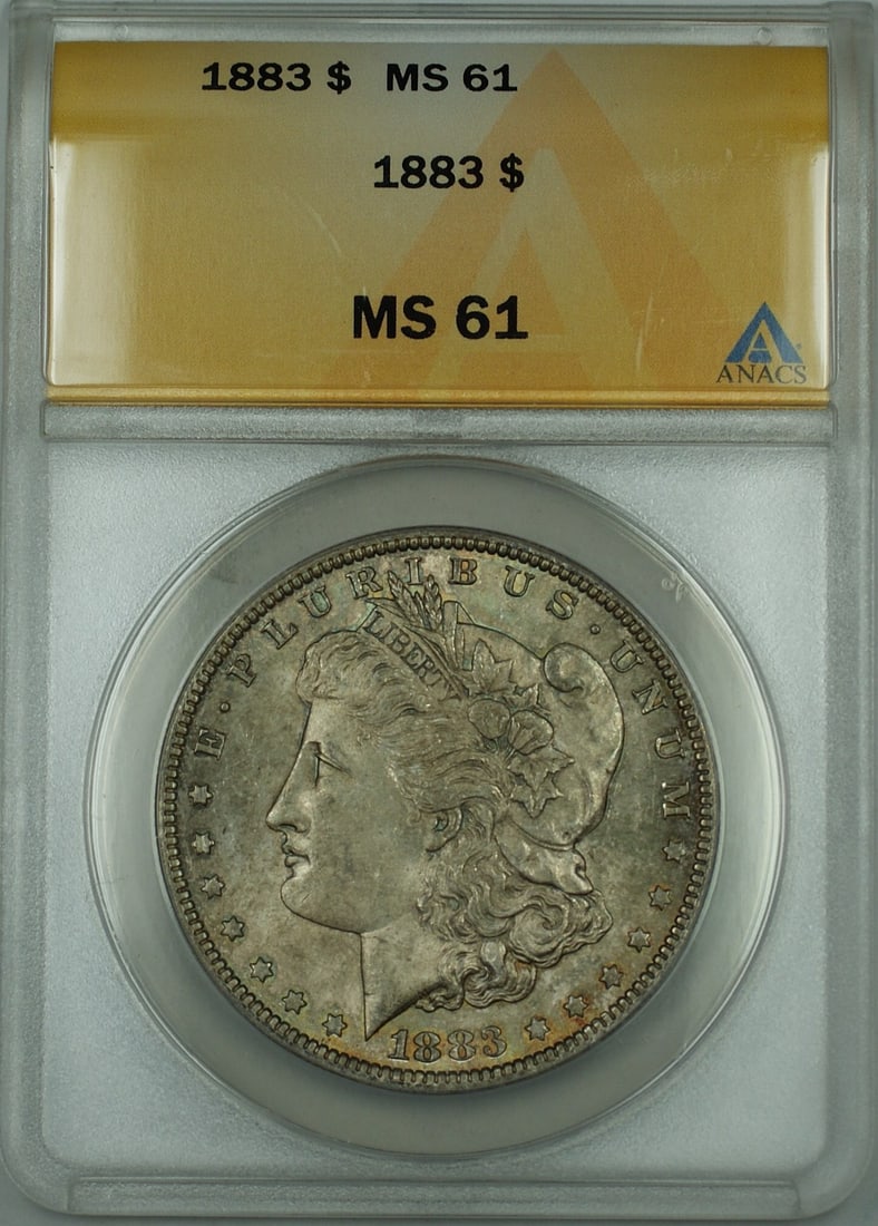 1883 Silver Dollar ANACS MS 61 Toned Obverse Philadelphia Mint: 1883 Silver Dollar ANACS MS 61 Toned Obverse Philadelphia Mint This is an 1883 Morgan Silver Dollar graded MS-61 by ANACS, featuring a toned obverse. The coin is uncirculated and was minted in Philade