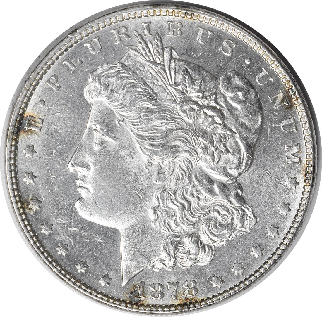1878 Morgan Silver Dollar AU Slider 90% Silver Uncertified: 1878 Morgan Silver Dollar AU Slider 90% Silver Uncertified This 1878 Morgan Silver Dollar features a classic design by George T. Morgan and is composed of 90% silver and 10% copper. It has been circul