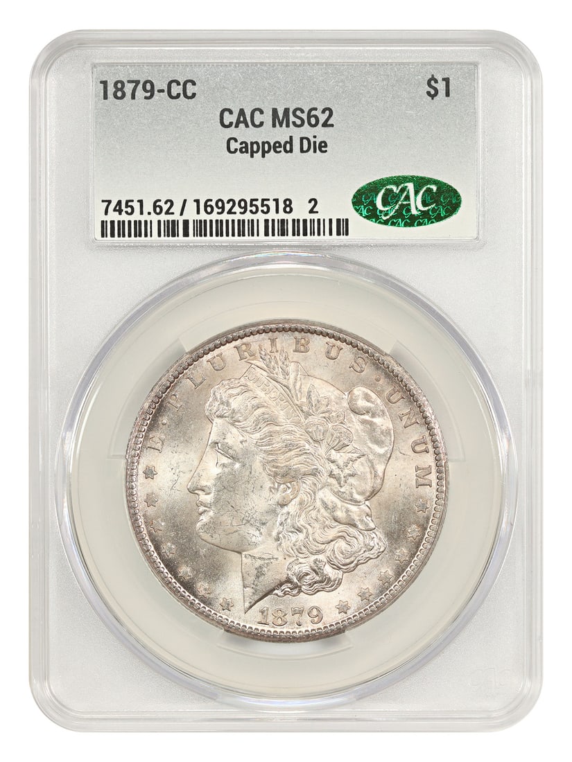 CACG MS62 1879-CC Morgan Dollar Capped Die Key Carson City Variety: CACG MS62 1879-CC Morgan Dollar Capped Die Key Carson City Variety This 1879-CC Morgan Dollar is a key date coin from the Carson City Mint, certified by CACG as MS62 (Capped Die). The coin features th