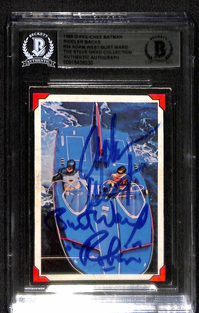 1966 OPC Batman #34 Signed by Adam West and Burt Ward Beckett Authenticated: 1966 OPC Batman #34 Signed by Adam West and Burt Ward Beckett Authenticated This remarkable item features the autographs of Adam West and Burt Ward, the iconic stars of the 1960s television series Bat