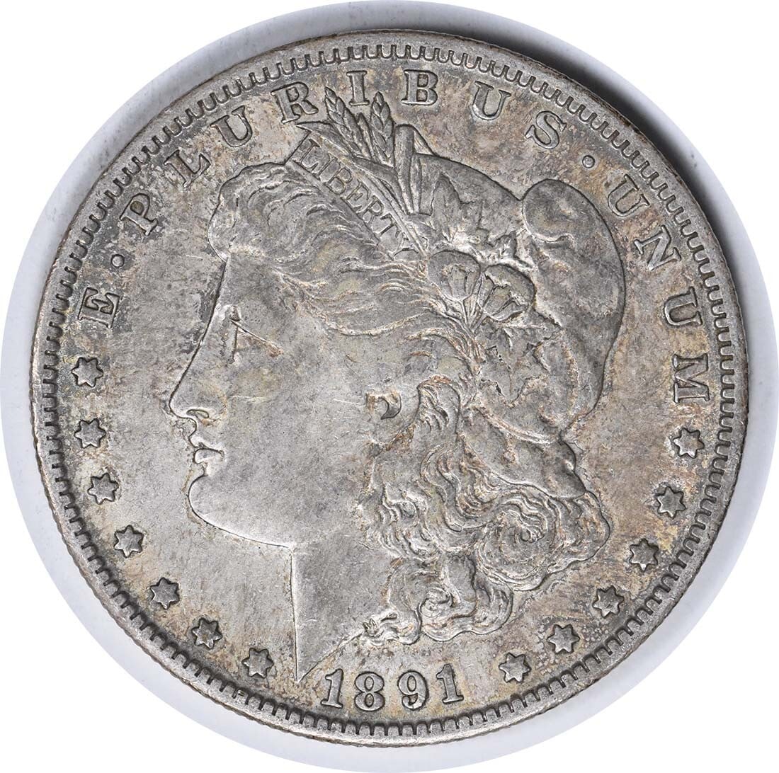 1891-O Morgan Silver Dollar 90% Silver EF Uncertified Coin: 1891-O Morgan Silver Dollar 90% Silver EF Uncertified Coin This 1891-O Morgan Silver Dollar showcases exquisite craftsmanship, designed by George T. Morgan. An iconic representation of American coinag