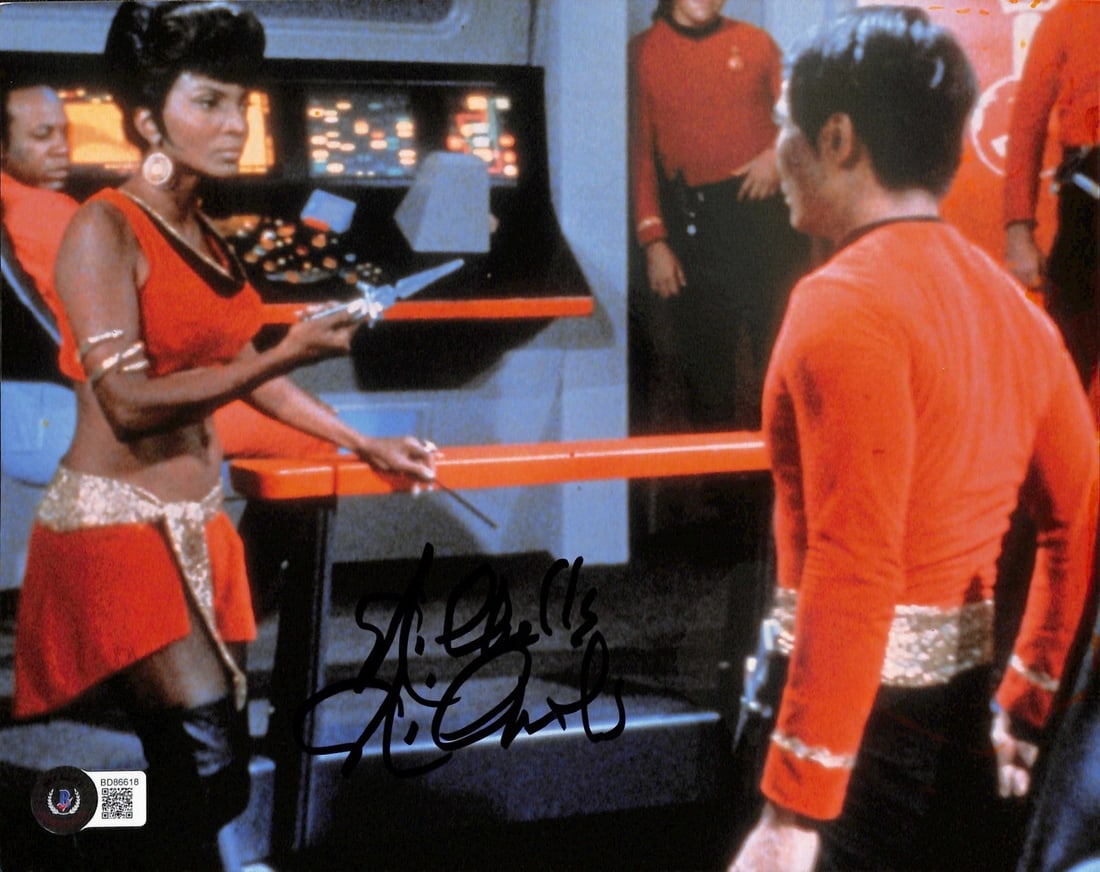 Nichelle Nichols Signed 8x10 Mirror Universe Uhura Photo Beckett Certified: Nichelle Nichols Signed 8x10 Mirror Universe Uhura Photo Beckett Certified This is a rare 8x10 photo of Nichelle Nichols as Lt. Uhura from the iconic Mirror Universe episode of Star Trek: The Original
