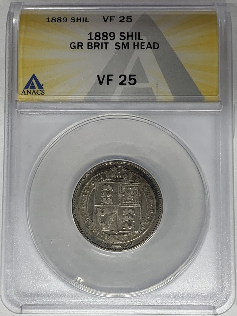 ANACS VF 25 1889 United Kingdom Small Head Shilling Coin: ANACS VF 25 1889 United Kingdom Small Head Shilling Coin This 1889 Great Britain Small Head Shilling is certified by ANACS with a grade of VF 25. The coin originates from the United Kingdom and featur